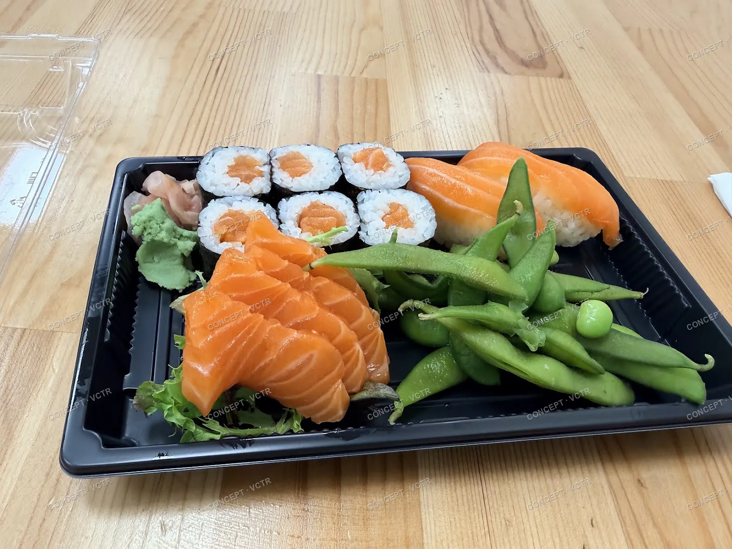 Yokisa salmon sashimi, maki, nigiri and edamame on a takeaway tray